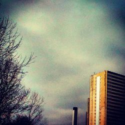 Low angle view of building against cloudy sky