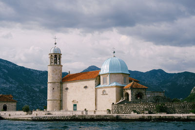 Historic building against cloudy sky