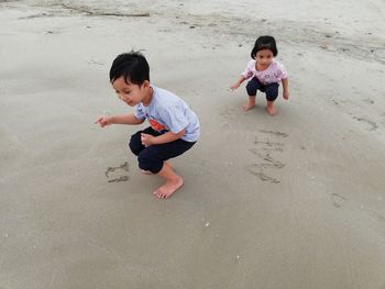 High angle view of two children at beach