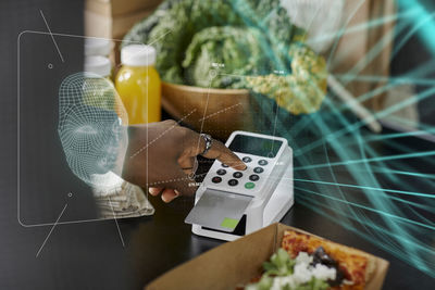 Woman paying for food with payment card