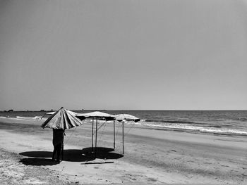 Scenic view of beach against clear sky