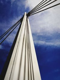 Low angle view of bridge against cloudy sky