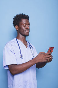 Young man using mobile phone