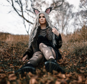 Young woman wearing mask on field