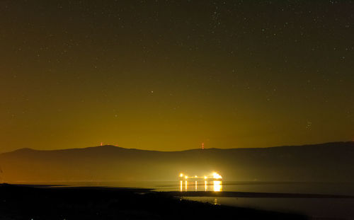 Scenic view of sea against sky at night