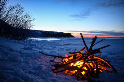 High angle view of bonfire on snow covered land
