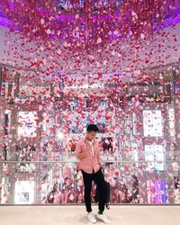 Full length of man standing on flower tree