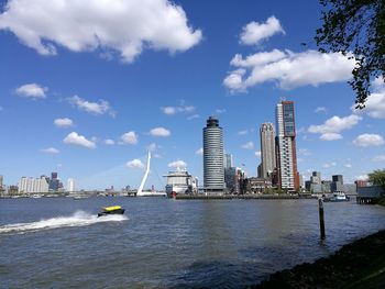 Scenic view of sea and buildings against sky