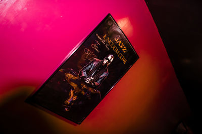 High angle view of illuminated lamp on table against wall