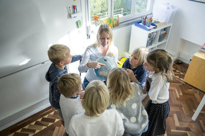 Teacher with children in classroom