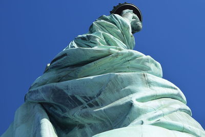 Low angle view of built structure against clear blue sky