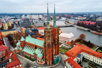 High angle view of buildings in city against sky