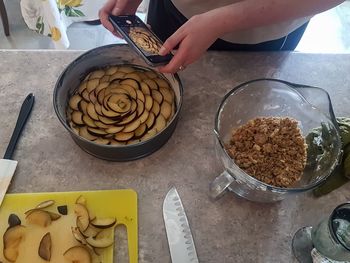 High angle view of person preparing food on table