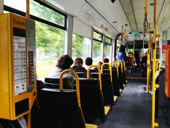 Rear view of passengers traveling in cable car