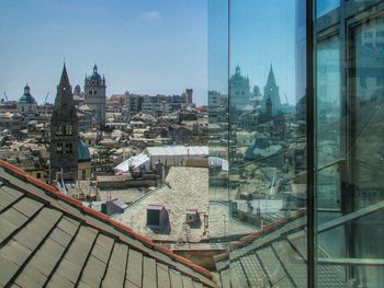 Buildings in city against sky