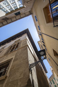 Low angle view of buildings against clear sky