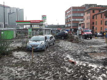 Cars on road against buildings in city