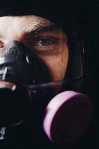 Close-up portrait of man holding camera