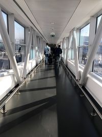 People walking on escalator in airport