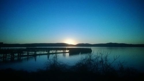 Scenic view of calm lake at sunset