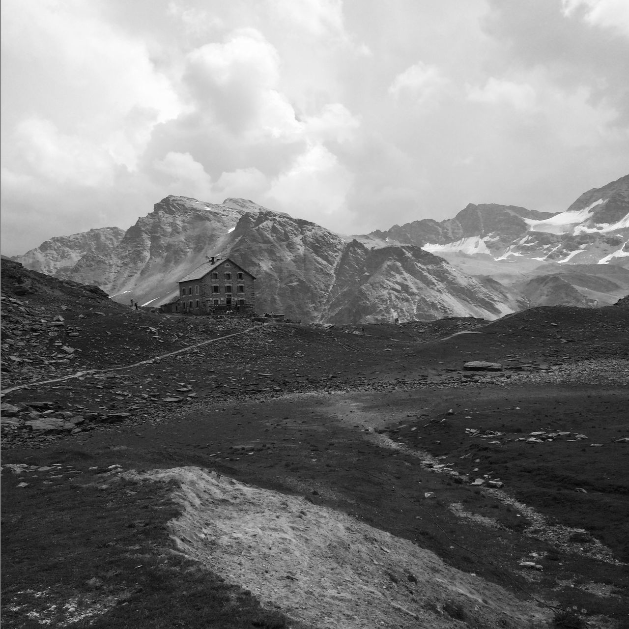 mountain, mountain range, tranquil scene, tranquility, scenics, sky, beauty in nature, cloud - sky, landscape, nature, cloudy, non-urban scene, snow, snowcapped mountain, winter, cloud, cold temperature, idyllic, weather, lake