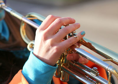 Close-up of hands playing guitar