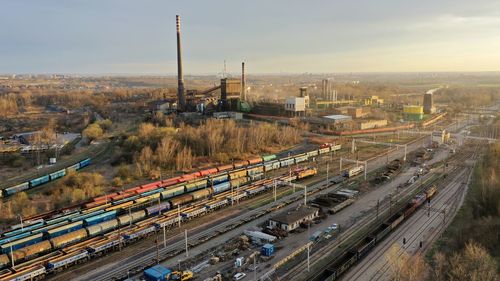 High angle view of train in city against sky