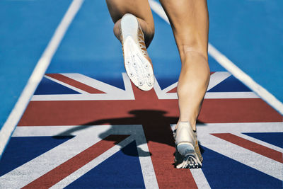 Low section of athlete on british flag