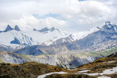 Scenic view of snowcapped mountains against sky