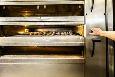 Close-up of man preparing food in kitchen