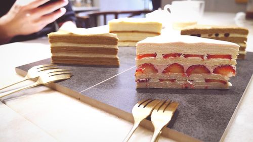 Close-up of person preparing food on table