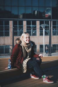 Young woman sitting outdoors