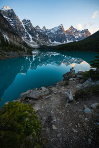 Sitting and enjoying sunset at moraine lake in lake louise banff