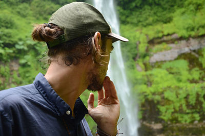 Portrait of man looking back