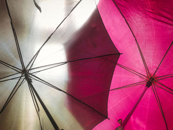 Low angle view of umbrella hanging from ceiling