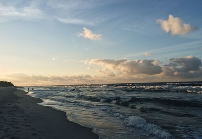 Scenic view of beach against sky during sunset