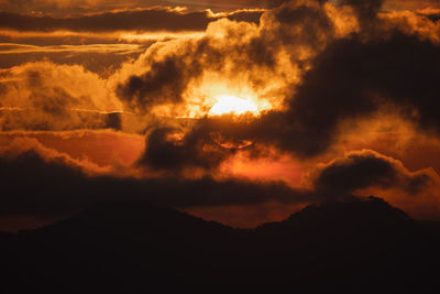 Low angle view of dramatic sky at sunset