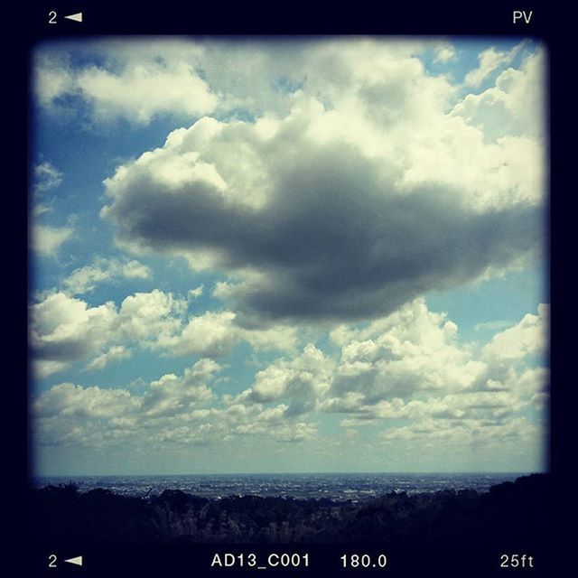 transfer print, sky, auto post production filter, cloud - sky, sea, cloudy, cloud, scenics, tranquil scene, beauty in nature, nature, text, tranquility, water, horizon over water, communication, outdoors, western script, no people, blue