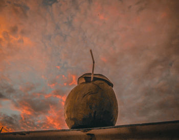 Low angle view of old ruin against sky during sunset