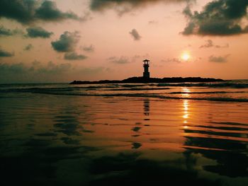 Scenic view of sea against sky at sunset