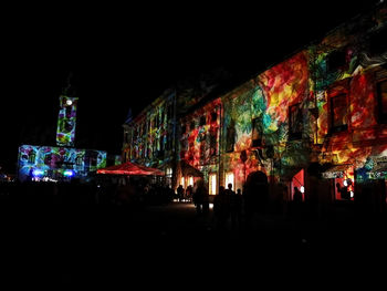 Illuminated buildings in city at night