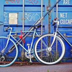 Close-up of bicycle wheel in city