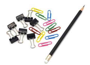 High angle view of colored pencils on white background