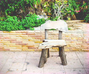 Bench on table by wall in park