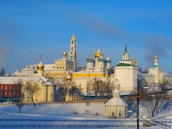 Buildings against sky during winter