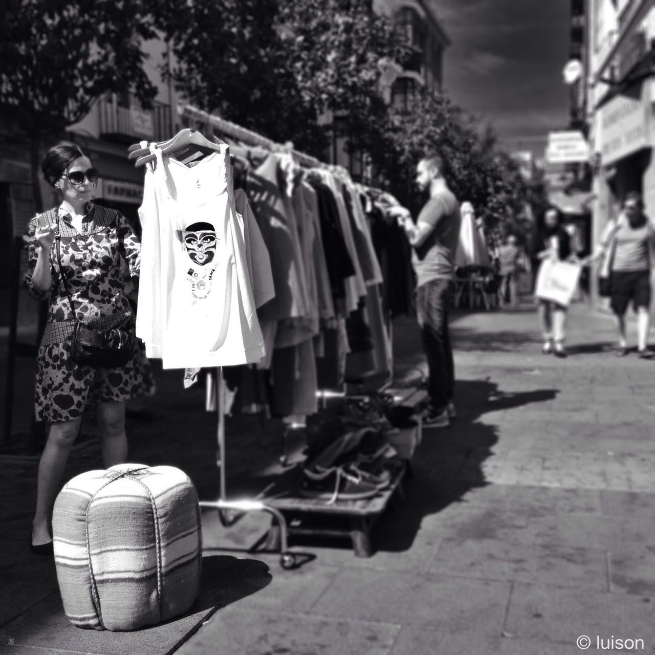 street, men, market, person, retail, market stall, transportation, large group of people, lifestyles, incidental people, road, car, land vehicle, city, for sale, mode of transport, city life, leisure activity, outdoors