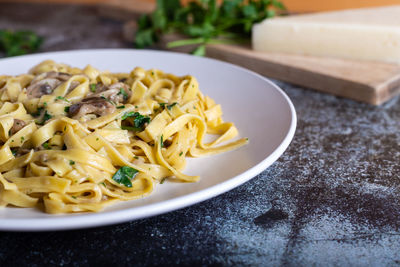 Italian fettuccine pasta with porcini mushrooms. italian pasta. vegetarian dish.