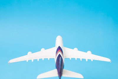 Close-up of blue over white background