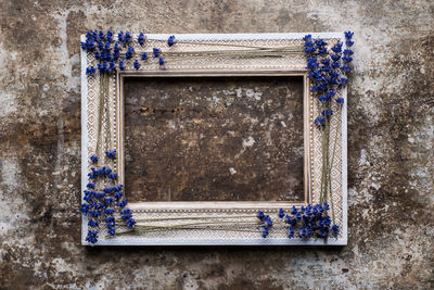 Rustic background with vintage wooden picture frame mock up and lavender.