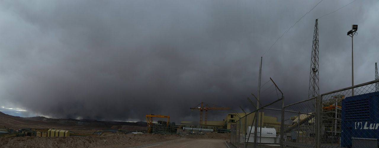 sky, transportation, built structure, architecture, cloud - sky, building exterior, cloudy, weather, land vehicle, overcast, mode of transport, outdoors, dusk, street light, storm cloud, road, house, no people, street, car